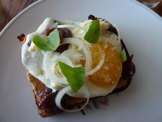 Odd Duck signature dishes Pork Belly, Cast Iron Duck Egg, Parker House Roll, Redfish Ceviche, and Goat Chili Frito Pie.